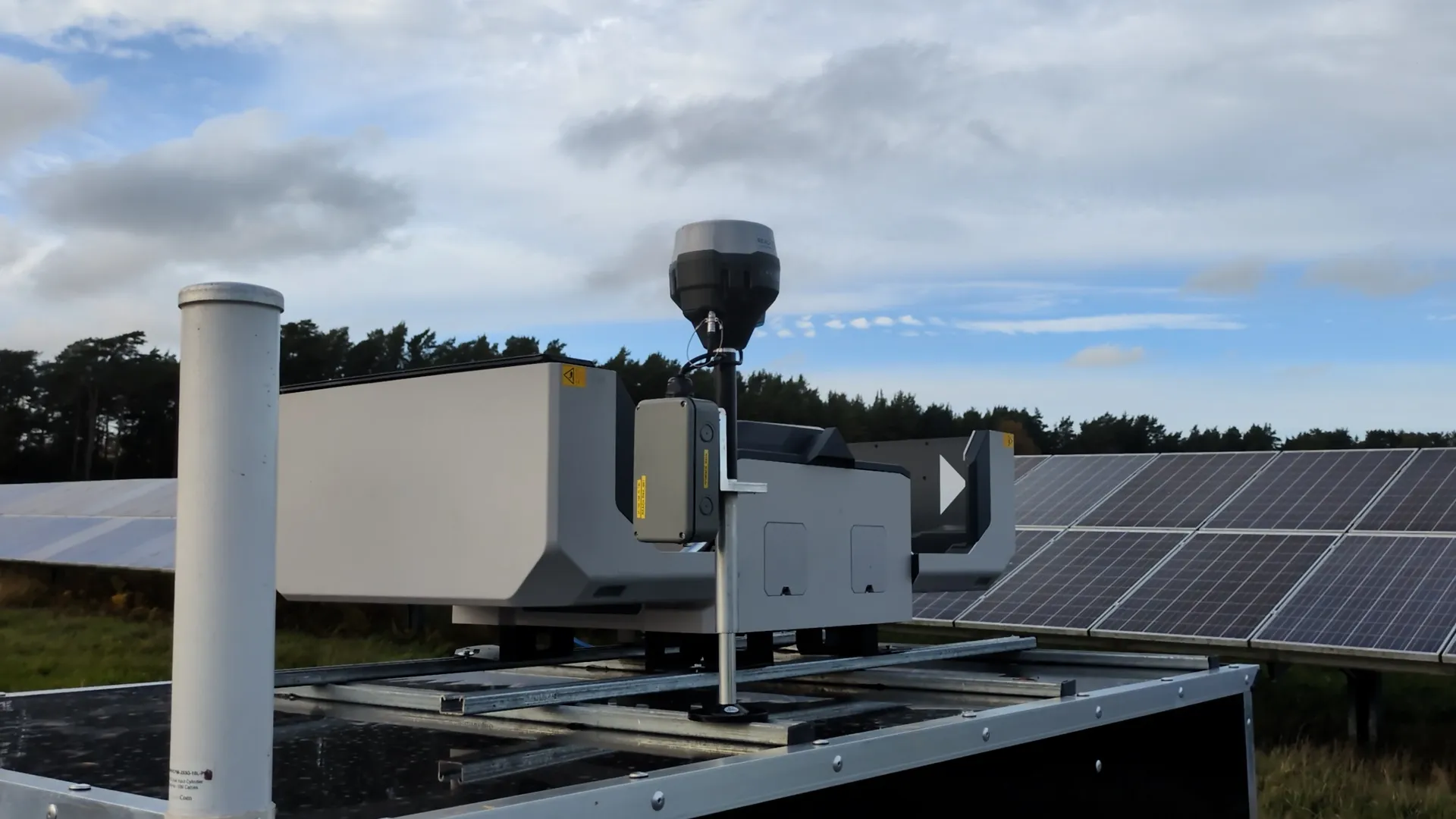 Drone dock with drone ready for automated solar farm inspection