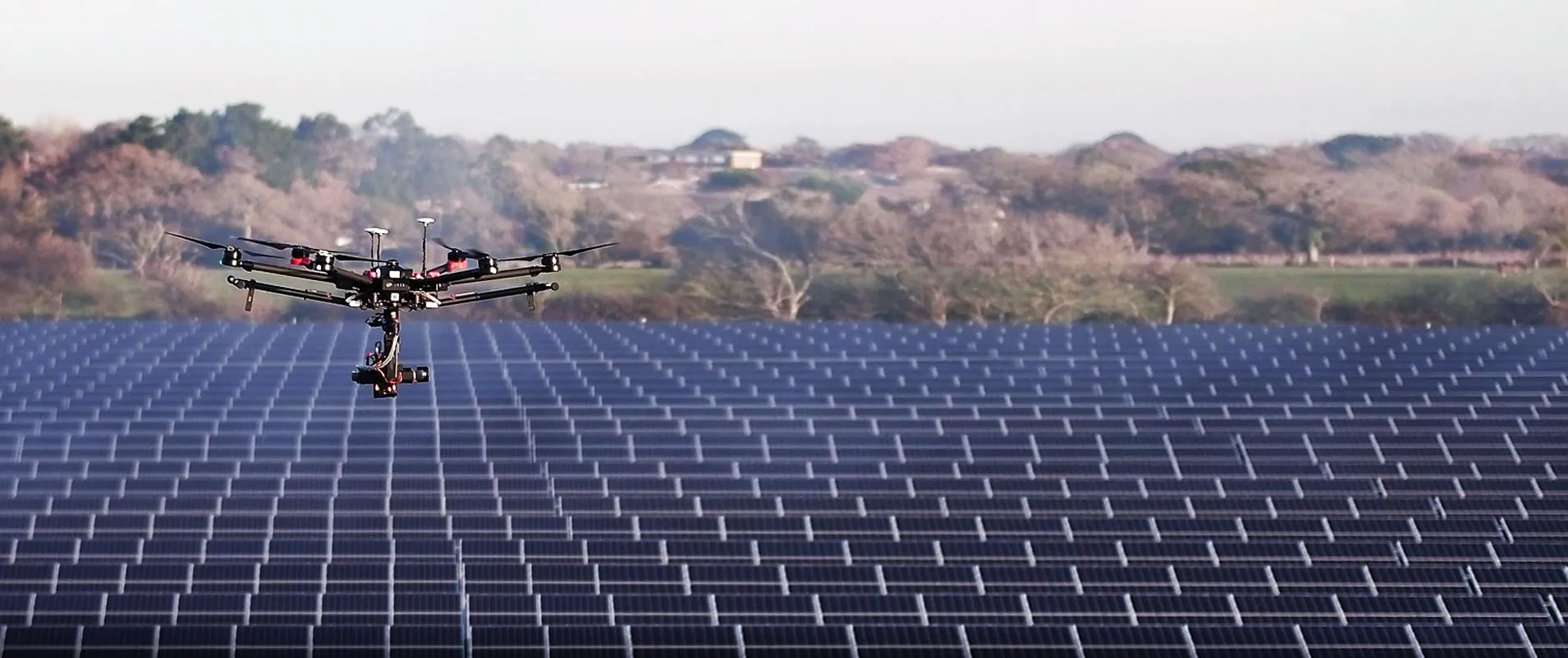 Drone performing solar farm inspection from above